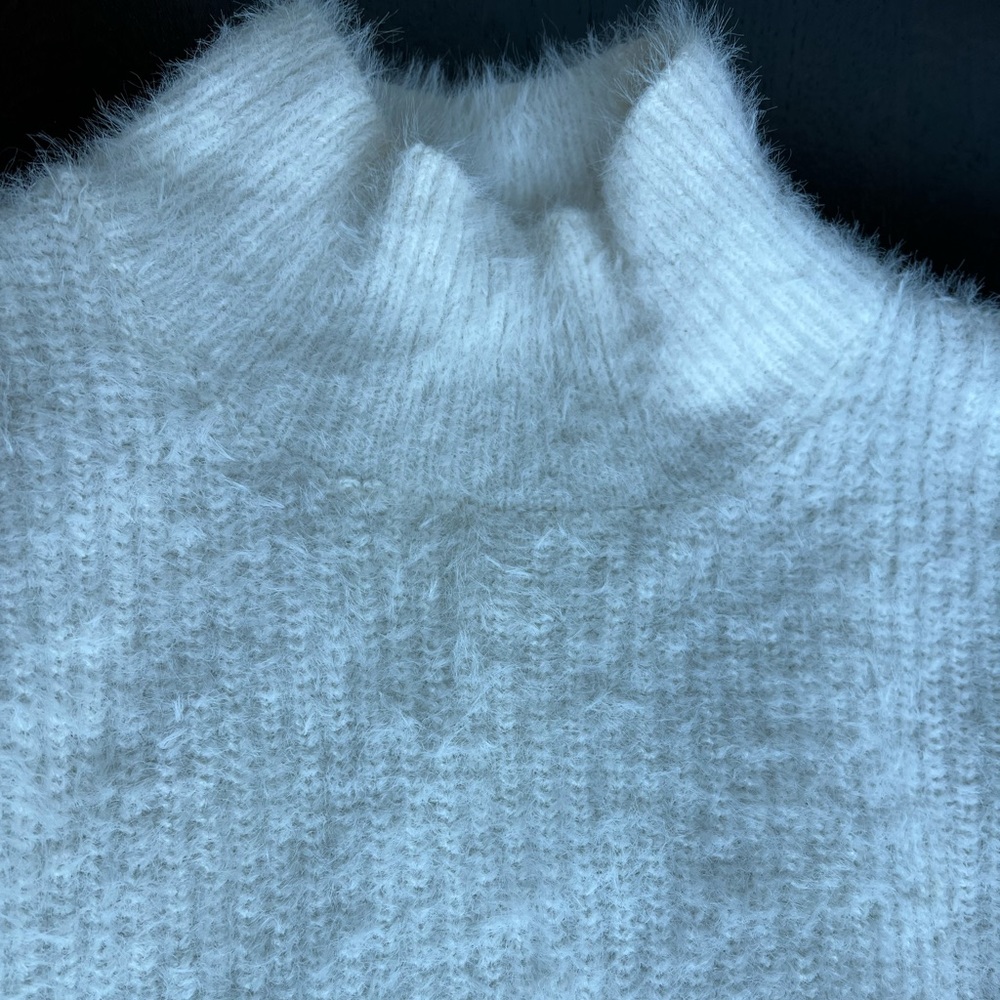 Fluffy looking white-beige sweater
